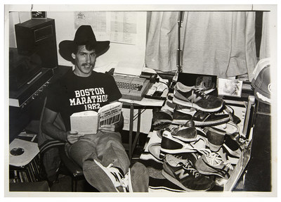 SHOES FOR CREWS CEO Stuart Jenkins, in a photo from 1980, surrounded by his collection of New Balance running shoes.