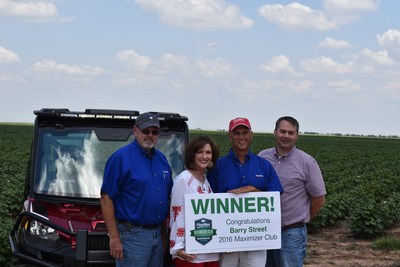 FiberMax grower Barry Street of Claytonville, Texas, won the sweepstakes drawing for a Polaris Ranger XP 1000 EPS. He and his wife, SuDe Street, received congratulations from Bayer Sales Representative Stan Warren (far left) and Southwest District Manager Dan Koch (far right).