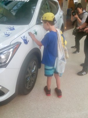 Young Boy Participates in a Hyundai Hope on Wheels Handprint Ceremony at University Hospitals Rainbow Babies & Children's Hospital in Cleveland on August 15th
