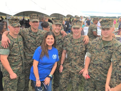 Nada Simon, President of the Sam & Nada Foundation, honors our military members.