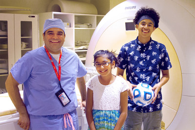Karun Sharma, M.D., Ph.D., director of Interventional Radiology at Children's National Health System, poses with 10-year-old Niyati Shah and 16-year-old Alfredo Coreas, the first two children with osteoid osteoma successfully treated in the U.S. as part of an innovative research study using noninvasive MR-HIFU.