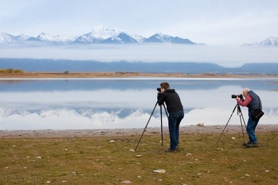 Neil Chaput and son, Forest, of Rocky Mountain School of Photography, snap a photo of the Montana scenery.