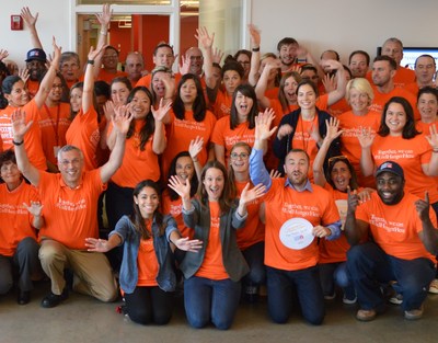 The Greater Boston Food Bank employees wear orange in support of Hunger Action Month. The public is encouraged to participate by wearing orange and getting involved in the various activities throughout the month of September.