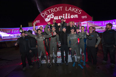 Travis Pastrana and co-driver Robbie Durant celebrate with their team