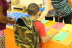 300 Spokane students receive free backpacks filled with school supplies for the new school year