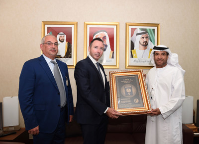 H.E. Ahmed Saeed Elham Al Dhaheri, Assistant Under-Secretary for Consular Affairs at the ministry of Foreign affairs and international cooperation of the UAE accepts the Passport Index certificate from Mr. Angel Kalinov and Mr. John Hanafin. (CNW Group/Arton Capital)