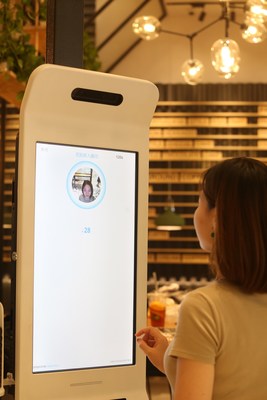 A customer paying using Alipay's new 