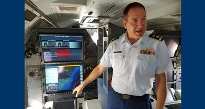 Chief Warrant Officer Robert Sunderland, technical lead for Minotaur Mission system integration, demonstrates data fusion and graphics processing capabilities on the Minotaur mission system prototype HC-144B Ocean Sentry medium range surveillance aircraft April 13, 2017. U.S. Coast Guard photo by Loretta Haring