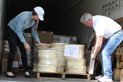 Pictured: WMMB's Social Media Specialist Lizzy Schultz and Director of Retail Programs Kirk Scott help pack the delivery truck for Houston.