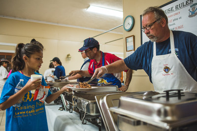 Members of Knights of Columbus Council 15828 in Ingleside, Texas, distribute food to victims of Hurricane Harvey.