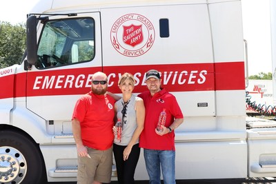 Max Roush, volunteer driver for The Salvation Army; Gena and Chuck Norris, owners of CForce Bottling Company