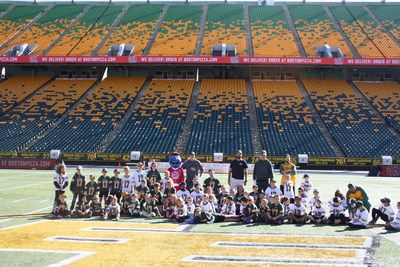 Lucky Kids Signed One-Day Contracts with the Edmonton Eskimos (CNW Group/Boston Pizza International Inc.)
