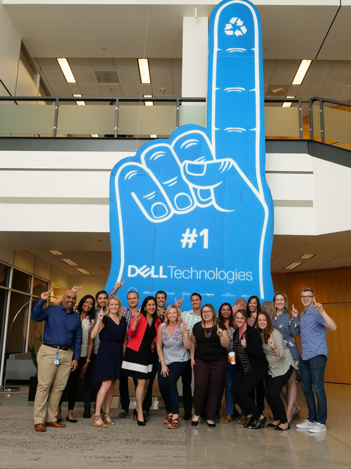 Dell Technologies employees pose with the largest foam finger (made of recyclable materials), a GUINNESS WORLD RECORDS™ achievement, at Dell’s headquarters in Round Rock, Texas on Monday, September 11, 2017.