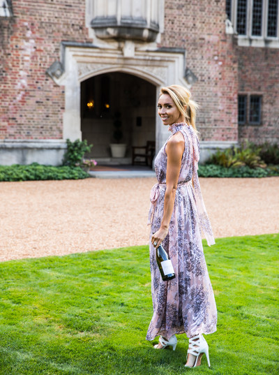 Giuliana Rancic at Terlato Wines’ Tangley Oaks Headquarters holding a bottle of newly launched, Giuliana Prosecco.