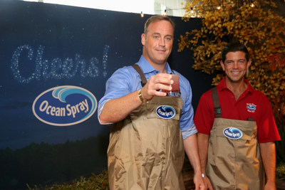 American Ninja Warrior host Matt Iseman toasts 'total victory' with a custom cranberry cocktail and Ocean Spray Farmer-Owner Clinton May at the Kari Feinstein Style Lounge Thursday, Sept. 14 in Los Angeles. (PRNewsfoto/Ocean Spray)
