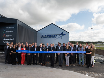 Caption: Mayor of Sola, Mr. Ole Ueland cuts the ribbon on Sikorsky's newly expanded Forward Stocking Location in Stavanger, Norway. Sikorsky hosted a celebration today marking the one-year anniversary of operations in its Stavanger Forward Stocking Location.