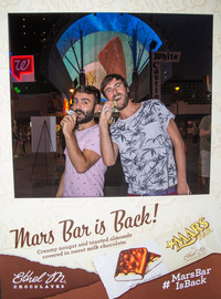 Visitors show off their best "Mars Bar face" while enjoying the newly relaunched Mars Bar at Fremont Street Experience.  The world's largest digital Mars Bar was also displayed under the Fremont Street Experience canopy.