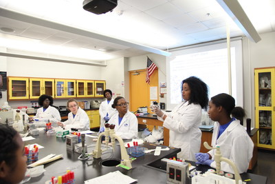Dr. M. Nia Madison, Assistant Professor at Miami Dade College and 2010 L'Oreal USA For Women in Science Fellow, and high school students from the Miami Dade College Microbiology Girls Club participate in experiments.