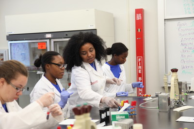 Dr. M. Nia Madison, Assistant Professor at Miami Dade College and 2010 L'Oreal USA For Women in Science Fellow, and high school students from the Miami Dade College Microbiology Girls Club participate in experiments.