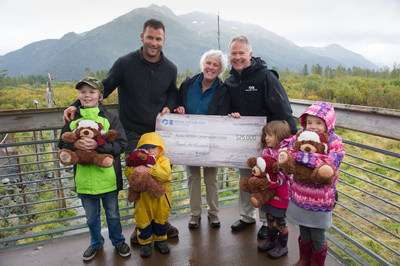 Princess Cruises Vice President of Public Affairs Ralph Samuels presents a $25,000 check to the Alaska Wildlife Conservation Center Board Member Karen Cowart, the cruise line’s first donation recipient from the Princess Animal Welfare Sponsor (PAWS). PAWS supports local causes and charities that foster nature, animals and wildlife. Also pictured: Animal Planet’s Dave Salmoni with local kids holding Stanley the Bears