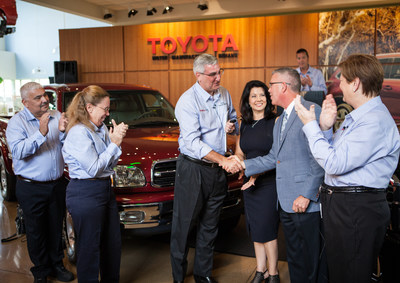 (l to r) Long-time team members Andres and Sandy Chaparro applaud while Indiana Governor Eric Holcomb is handed the keys to the plant’s five millionth vehicle, a 2018 Sequoia, from Butch Hancock, General Manager of Evansville’s Kenny Kent Toyota as Plant President Millie Marshall looks on.