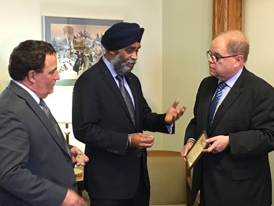 Dr. McCormick (right), President and Vice-Chancellor of Huntington University and Honorary Lieutenant-Colonel of the Irish Regiment of Canada, was in Ottawa earlier today with MP Marc Serré (left), the project’s Champion, to present Minister Sajjan (centre) with a Memorial Cross belonging to a soldier who fought in the First World War and whose ultimate sacrifice is immortalized at the Canadian National Vimy Memorial in France. (CNW Group/Huntington University)
