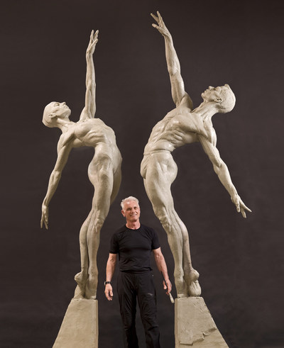 Richard MacDonald stands with the Male and Female Allonge sculptures created for the Royal Ballet in London.