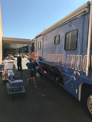 Atlas President Bob Kenyon helps load essential supplies into the Atlas Cares RV before it leaves for Puerto Rico.