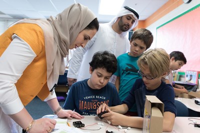 Beacon of Hope and UAE Embassy diplomats work with students in Washington, DC to build solar lights to send to children in refugee camps around the world.