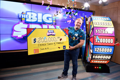 Derick Smith of Dunnville celebrates after spinning THE BIG SPIN Wheel at the OLG Prize Centre in Toronto to win $200,000. Smith was the first top prize winner of OLG's new INSTANT game – THE BIG SPIN. (CNW Group/OLG Winners)