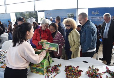 Copenhagen-based attendees visiting the exhibition area for Sanya's local specialty products