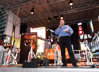 Scott Rosen, President and Chief Operating Officer of Equinox, Cycle for Survival's founding partner, tells riders at the Times Square Takeover why Equinox is committed to the movement to beat rare cancers. The event kicks off registration and fundraising for the indoor cycling rides that will take place in 16 cities across the country in 2018 ? all led by Equinox instructors. (Photo Credit: Diane Bondareff, Cycle for Survival)