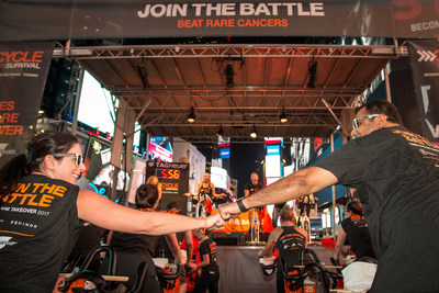Riders at Cycle for Survival's Times Square Takeover show their support for the movement to beat rare cancers. The event celebrates the launch of registration and fundraising for Cycle for Survival's 2018 indoor cycling rides. Every dollar raised goes to rare cancer research. (Photo Credit: Michael J. Le Brecht II, Cycle for Survival)