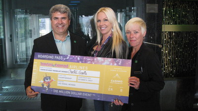 The Director of the Casino de Mont-Tremblant, Gilles Monfette (left), and executive host Kimberley Cully (right), present Chantal Goyette (centre) with the prize that will enable her to fly to Las Vegas in October to take part in a slot machine tournament. (CNW Group/Loto-Québec - Communications)