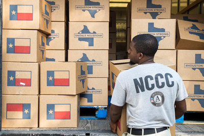 Darien Burrell, an AmeriCorps member serving with the American Red Cross, delivers meals and supplies to Houston residents impacted by Hurricane Harvey. [Corporation for National and Community Service Photo]