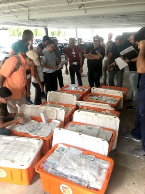 Doctors and nurses meet with Direct Relief staff Friday morning in San Juan, Puerto Rico to stock up on emergency supplies. Direct Relief provided staff with Emergency Health Kits, which contain basic medicines and first aid supplies, which equipped the healthcare providers as they traveled to 15 different towns across Puerto Rico to provide medical care. (Gordon Willcock/Direct Relief)