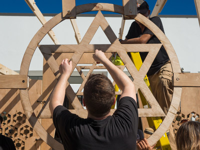 A group of student architects from the NewSchool of Architecture & Design in San Diego, and under the direction of Professor Chuck Crawford, collaborated to build a sukkah -- a temporary dwelling to commemorate Sukkot, the seven-day Jewish harvest festival. The structure now sits on the Jewish Family Service (JFS) of San Diego’s Joan & Irwin Jacobs Campus. With three walls and an open door, the sukkah represents inclusivity, hospitality, and the temporary nature of life.