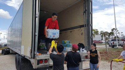 Students and Volunteers Deliver Water From Truck Donated by National Air Cargo Holdings, Inc.