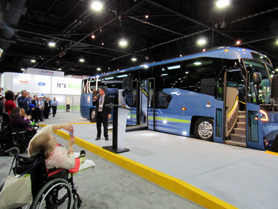 MCI President Ian Smart unveils all-new 54-passenger  D45 CRT LE with a low entry mid-door and adjoining vestibule seating for five, or two passengers using mobility devices - a breakthrough design in ADA accessibility - at APTA EXPO 2017 Oct. 9-11 in Atlanta, GA. (CNW Group/New Flyer Industries Inc.)