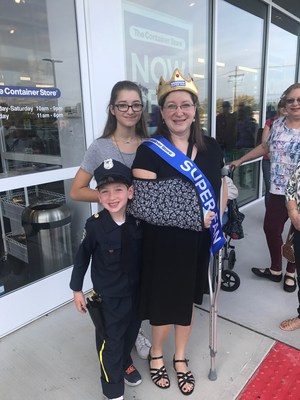 Super Fan Stacy Hirschberg outside of The Container Store in Livingston, NJ with her family after being crowned.
