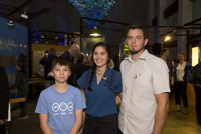Artists Daniel Ranger, Laura Mendes and John Loerchner help unveil DEEP BLUE, a stunning, community-based art installation comprised of more than 2000 origami shapes, at the Ontario Science Centre today. DEEP BLUE showcases the ecology – and grandeur – of Lake Ontario. (CNW Group/Ontario Science Centre)