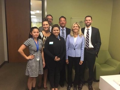 State Rep. Tina Orwall, D-Des Moines, (center) is joined by (L to R) Tawny Nguyen, Multi-Lingual Call Center Supervisor II; Kristina Kovalevich, Call Center Supervisor I; Phil Hill, PCG Customer Service Operations Manager; May Salvo, Provider Management Supervisor; John Purnell PCG Senior Program Manager; and David O’Leary, PCG Senior Consultant of Education