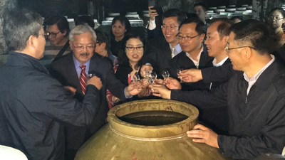 Mayor Lee and his wife tasting Moutai in the production facility's cellar