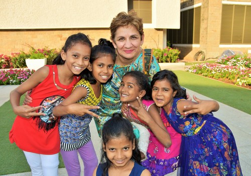 Classical Movements Founder and President Neeta Helms poses with children from Songbound in Mumbai, India