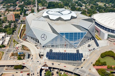 Solar panels in foreground are part of Georgia Power’s 4,000-panel solar project at Mercedes-Benz Stadium. Photo credit: HHRM/Aerial Innovations