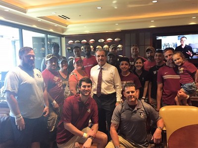 Wounded Warrior Project alumni and their family members with Florida State University's head football coach, Jimbo Fisher.