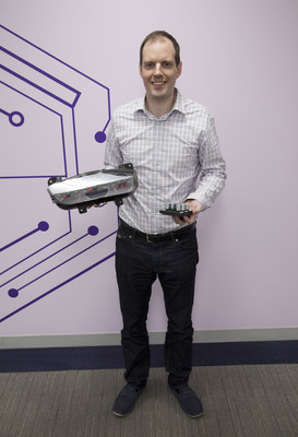 NYU Tandon Professor Justin Cappos with examples of automotive components that Uptane can protect from malicious software: the instrument panel, which hackers can attack to indicate a car is traveling safely when it is in fact speeding and a gas gauge that might not signal when the tank is nearing empty; pictured right, the actuator that control the brakes.