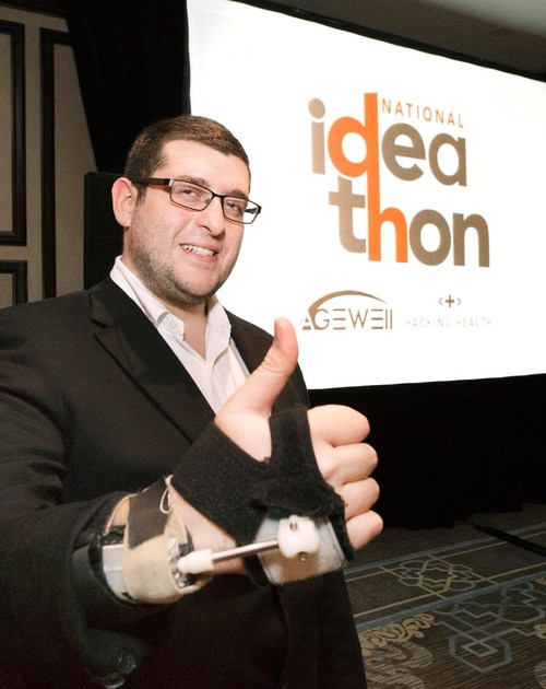 Mark Elias, CEO of Steadiwear, shows an early prototype of a "smart" glove designed to decrease hand tremors. (CNW Group/AGE-WELL Network of Centres of Excellence (NCE))