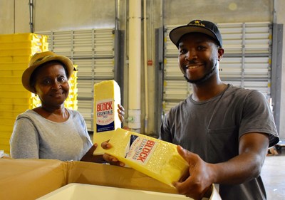 Good News, a partner agency of Feeding South Florida, are selecting calcium-rich cheese to distribute to food insecure families in Miami-Dade County.