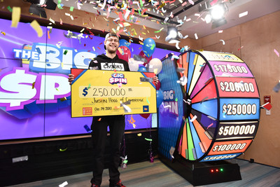 Justin Hogg of Cambridge celebrates after spinning THE BIG SPIN Wheel at the OLG Prize Centre in Toronto to win $250,000. Hogg won a top prize with OLG’s new INSTANT game – THE BIG SPIN. (CNW Group/OLG Winners)